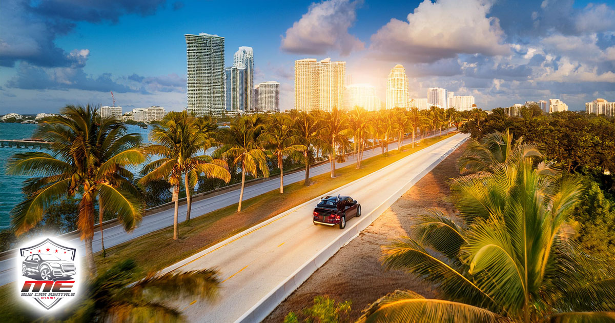 luxury suv riding down scenic view in miami florida